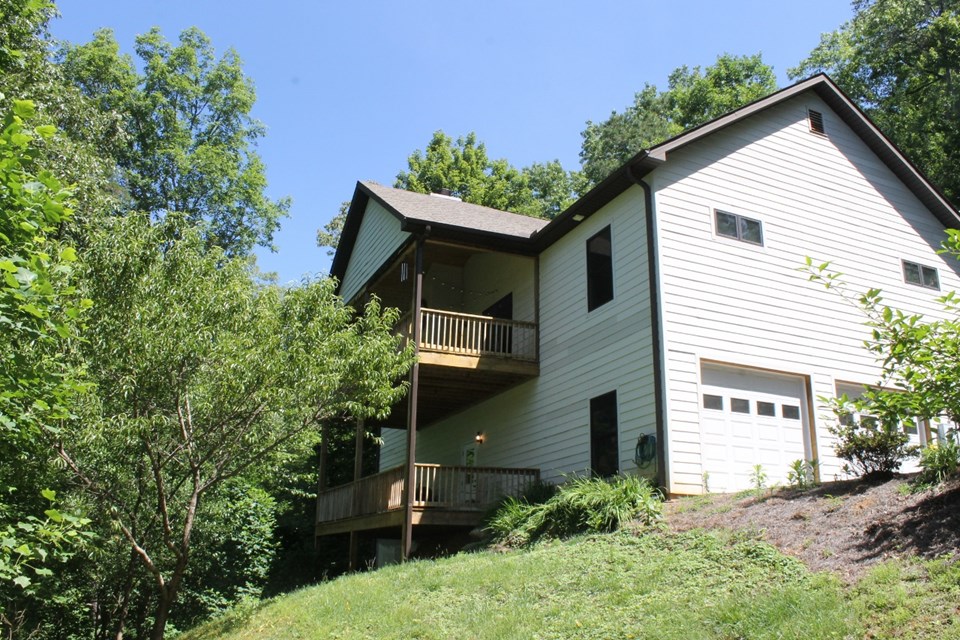 2 levels with decks, 2 car garage, and paved driveways