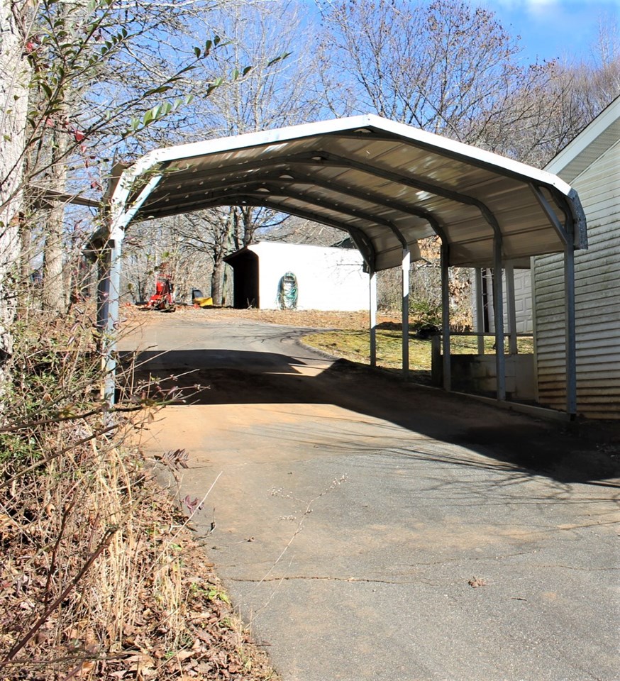 carport with entry to covered walkway