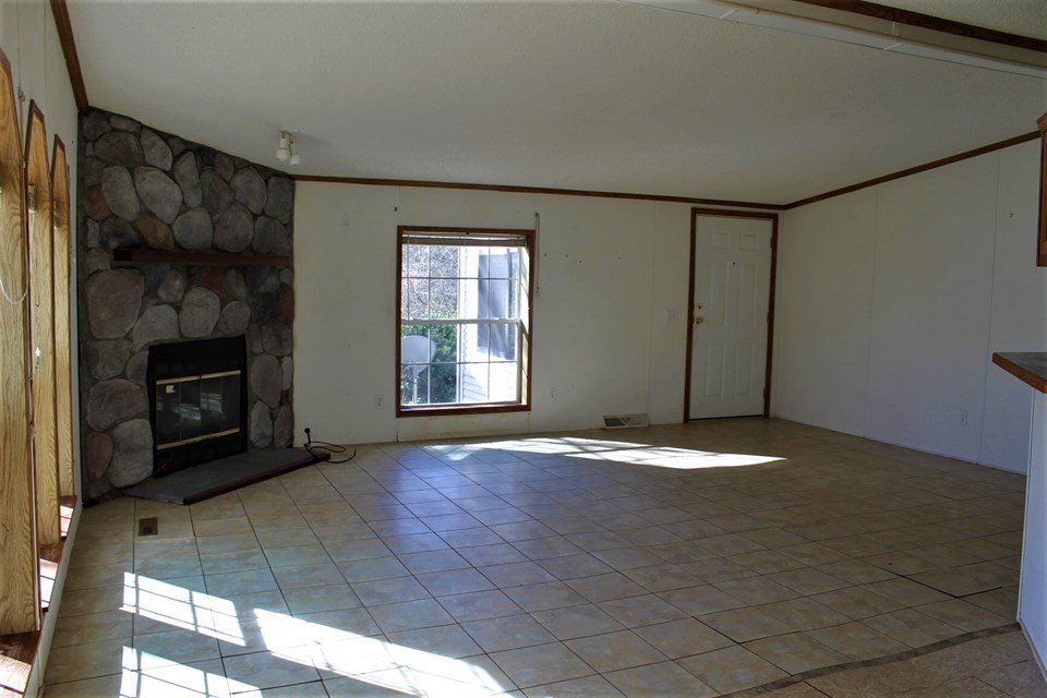 spacious living room with gas log fireplace