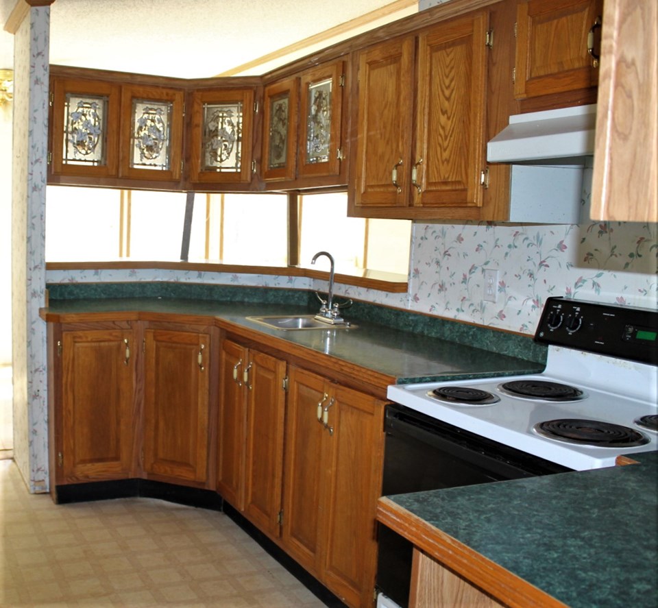 kitchen features breakfast bar and bar sink