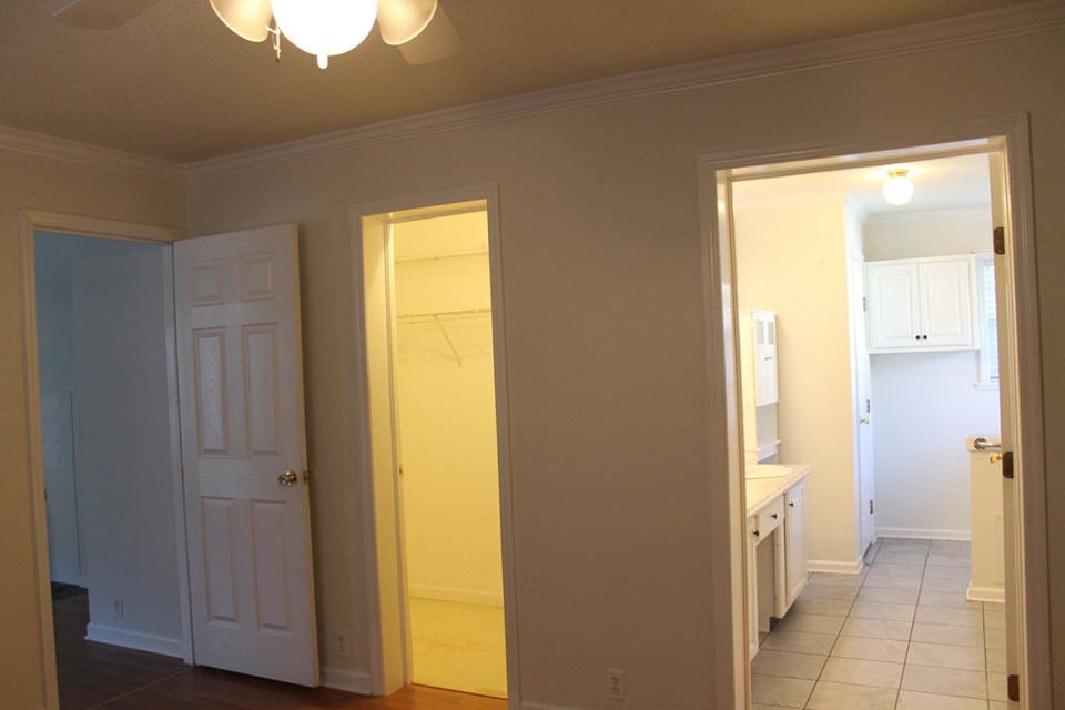 walk-in closet and large bath with laundry